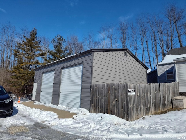 view of snow covered garage