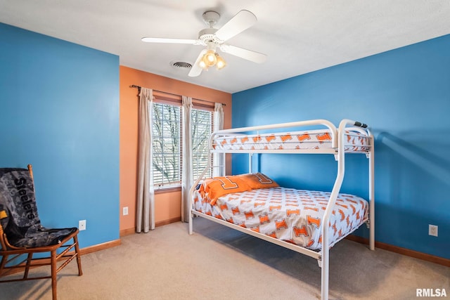 carpeted bedroom featuring visible vents, ceiling fan, and baseboards