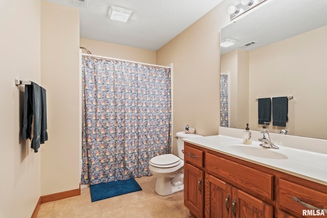 bathroom with toilet, visible vents, and vanity