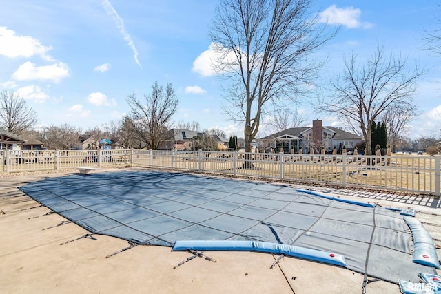 view of pool featuring playground community, fence, and a fenced in pool