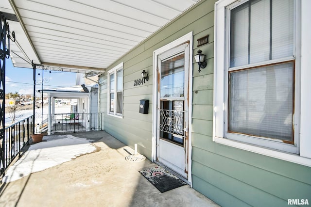 view of patio featuring a porch