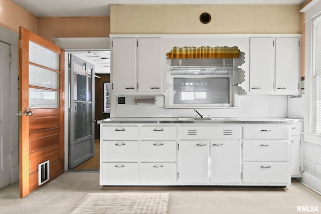 kitchen with white cabinets and sink