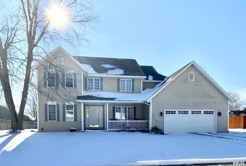 view of front facade featuring a garage and covered porch