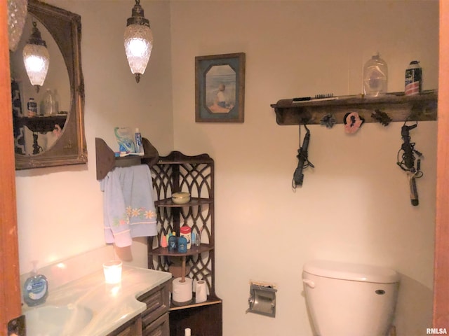 bathroom featuring toilet and vanity