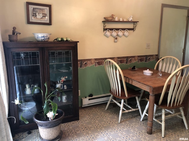 dining room with a baseboard heating unit