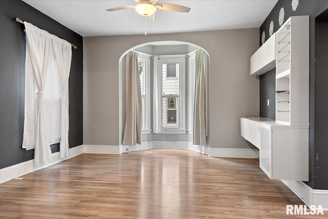 interior space featuring ceiling fan and light wood-type flooring