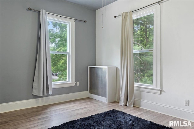 spare room featuring light wood-type flooring