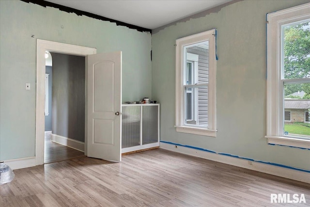 spare room featuring light hardwood / wood-style flooring