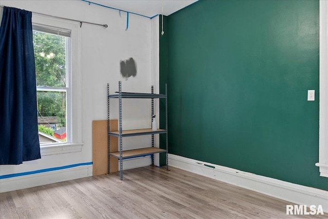 spare room featuring light hardwood / wood-style flooring