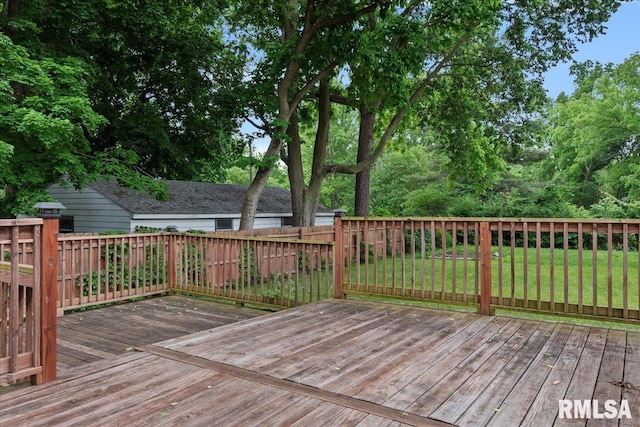 wooden terrace with a yard