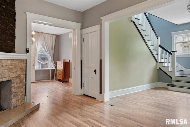 unfurnished living room with light wood-type flooring