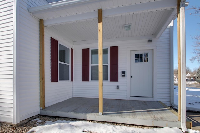 view of snow covered property entrance