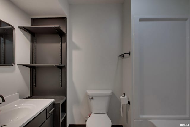 bathroom with toilet and vanity