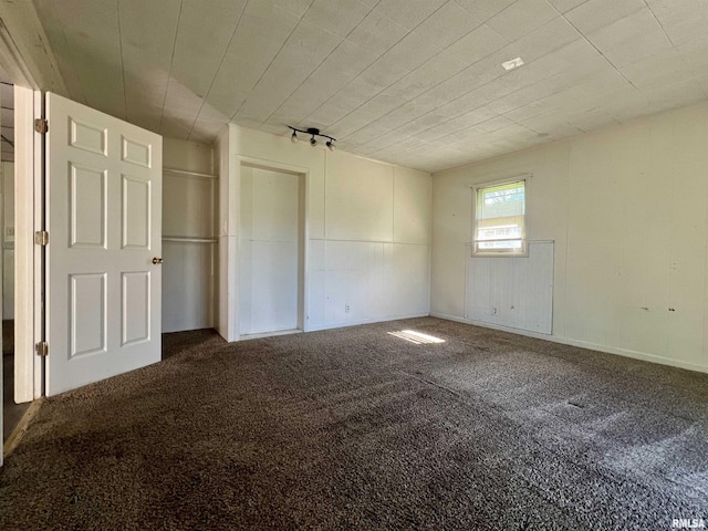 unfurnished bedroom with carpet flooring