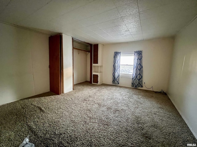 unfurnished bedroom with carpet