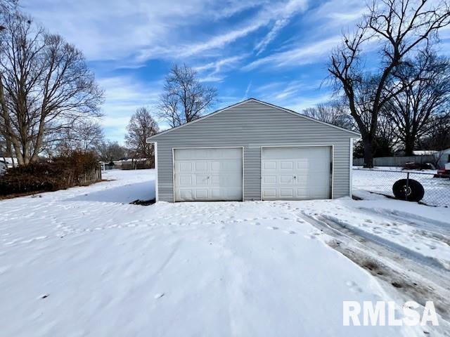 view of snow covered garage