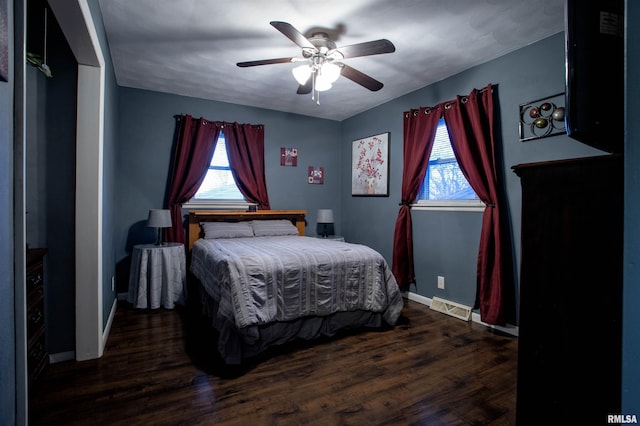 bedroom featuring ceiling fan and dark hardwood / wood-style floors