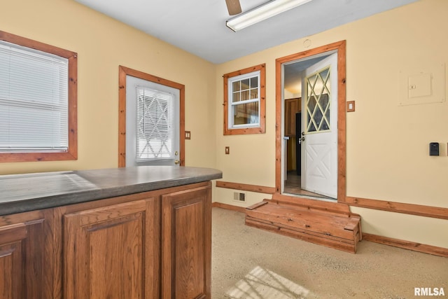 interior space featuring ceiling fan and visible vents