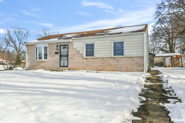 view of front facade featuring brick siding