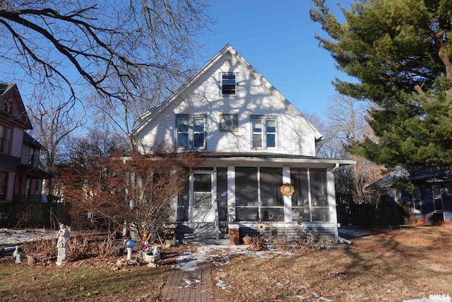 view of front of house featuring a sunroom