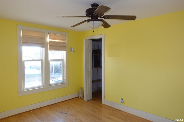 unfurnished room featuring ceiling fan and light hardwood / wood-style floors