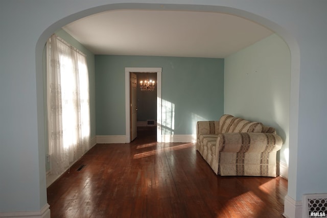 sitting room with dark hardwood / wood-style flooring