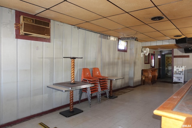 basement featuring a wall mounted air conditioner