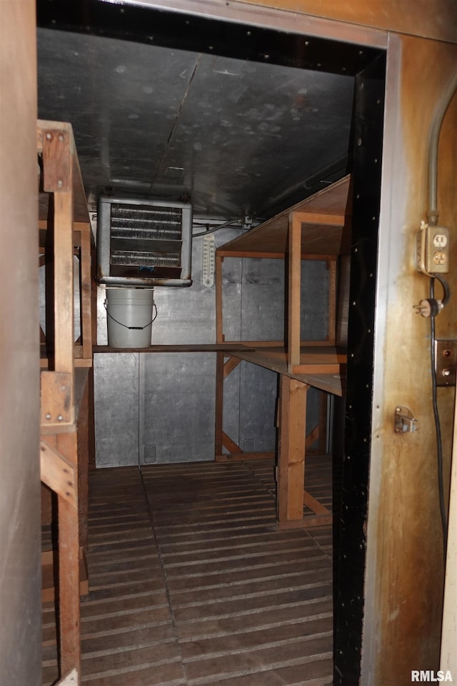 basement with dark wood-type flooring