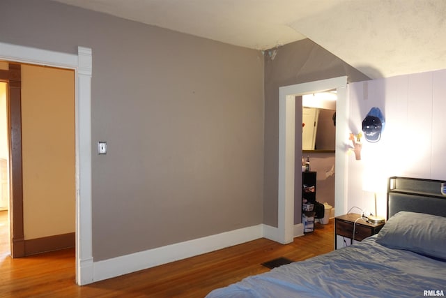 bedroom featuring hardwood / wood-style flooring