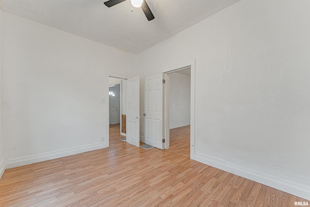 spare room with light hardwood / wood-style floors and ceiling fan