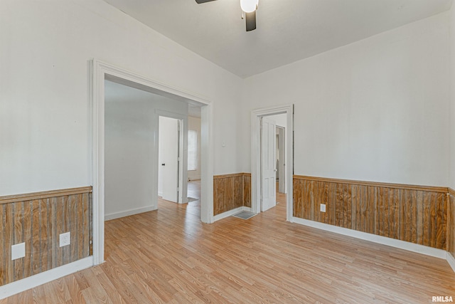 spare room featuring ceiling fan and light hardwood / wood-style floors