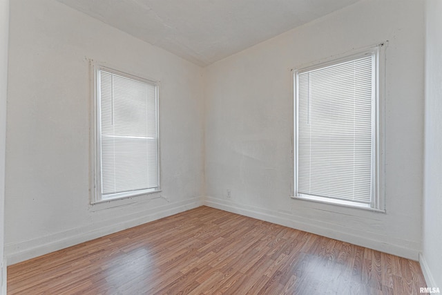 unfurnished room with light hardwood / wood-style flooring