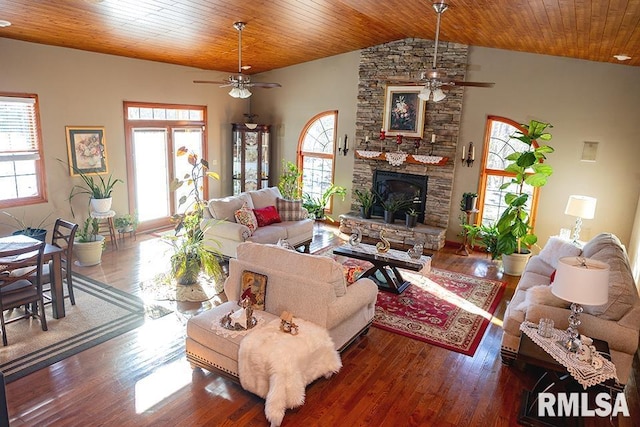 living room with dark hardwood / wood-style floors, vaulted ceiling, a healthy amount of sunlight, and wood ceiling