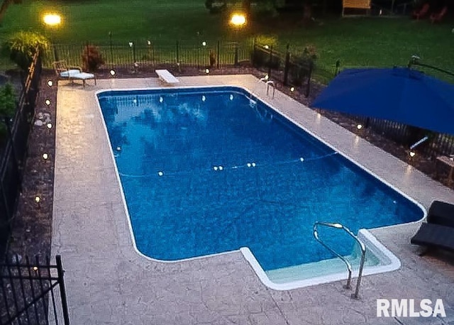 pool at night with a diving board