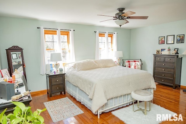 bedroom featuring wood-type flooring and ceiling fan