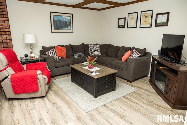 living room featuring a fireplace, light wood-type flooring, beamed ceiling, and coffered ceiling