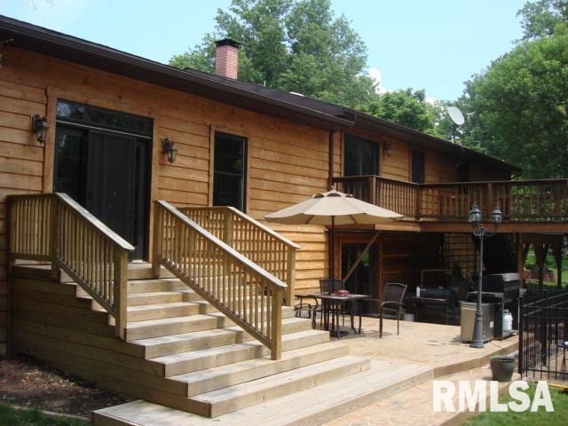 back of property featuring a patio area