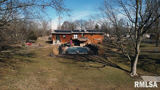 view of home's exterior with a wooden deck and solar panels