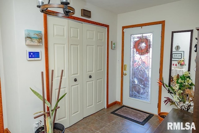 entrance foyer featuring a notable chandelier