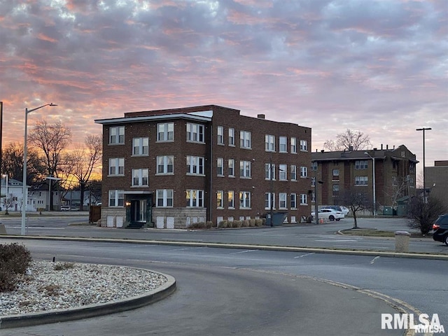 view of outdoor building at dusk