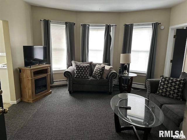 carpeted living room featuring a baseboard heating unit