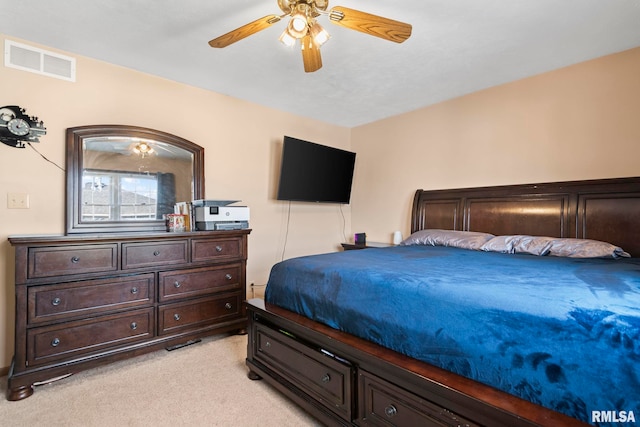 bedroom featuring ceiling fan and light carpet