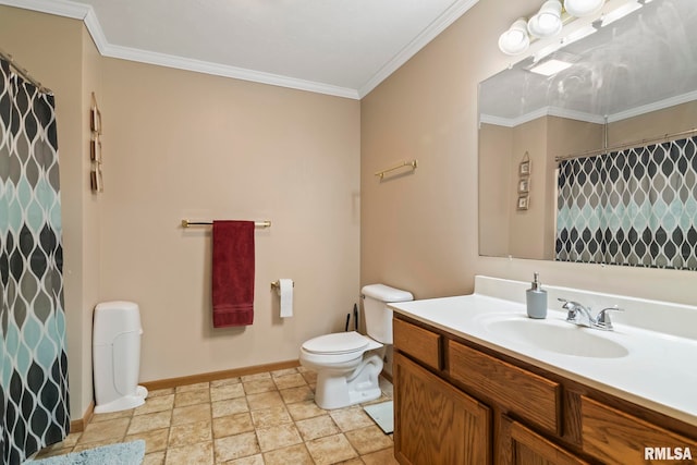 bathroom with ornamental molding, vanity, and toilet