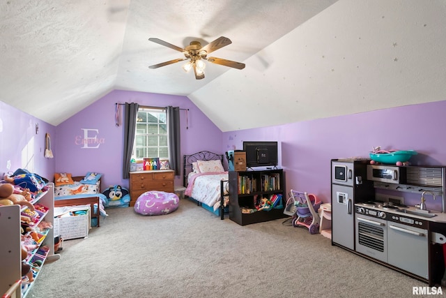 carpeted bedroom featuring ceiling fan, lofted ceiling, and a textured ceiling