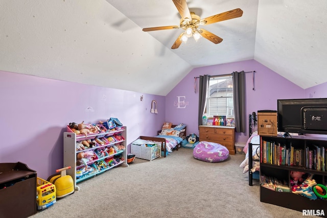 bedroom featuring lofted ceiling, carpet floors, a textured ceiling, and ceiling fan