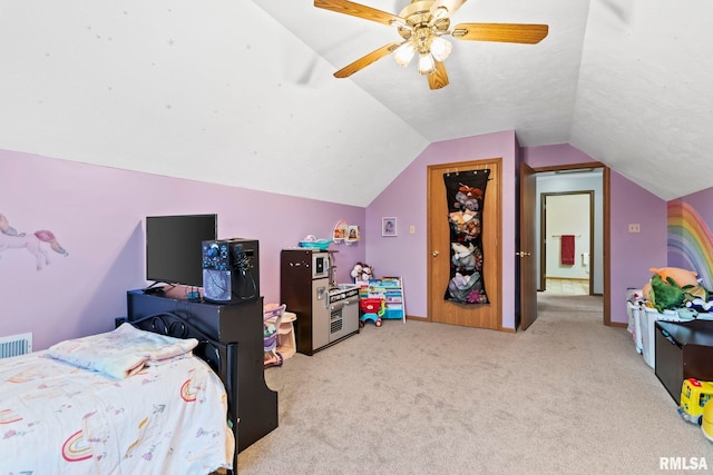 bedroom featuring vaulted ceiling, light carpet, and ceiling fan