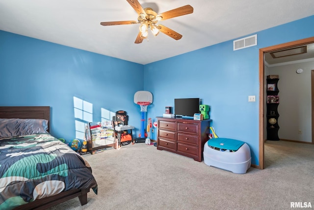 carpeted bedroom with crown molding and ceiling fan