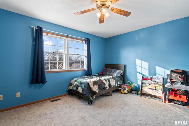 bedroom featuring light carpet and ceiling fan