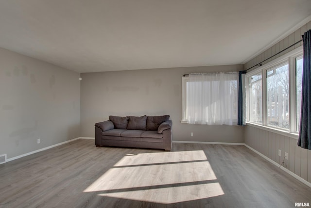 living area with light hardwood / wood-style flooring