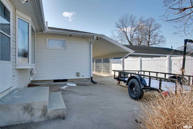 exterior space with a carport